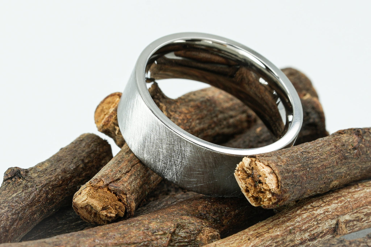 "Brüns" titanium ring with distressed finish on twigs