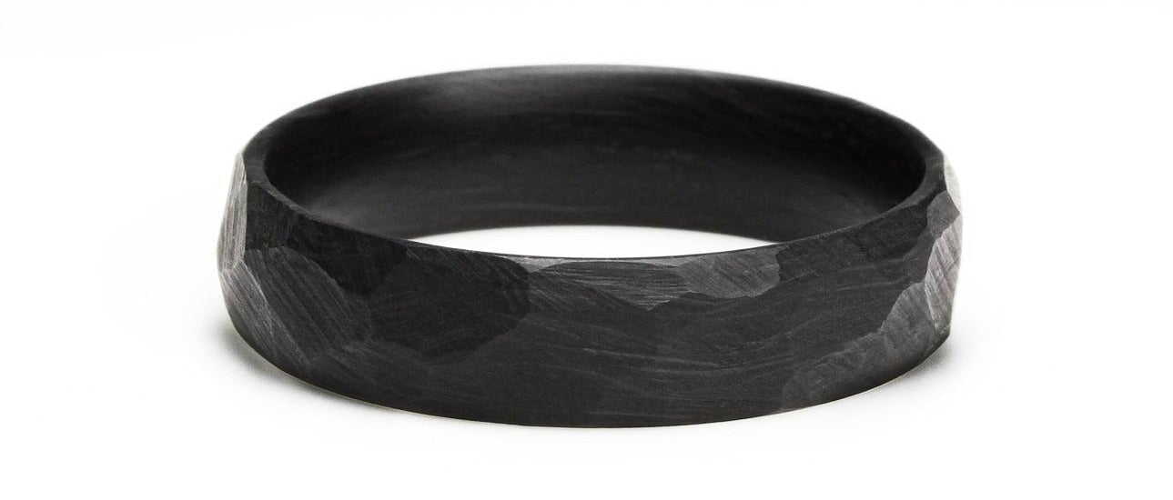 Close-up of 'Bates' carbon fiber ring's texture
