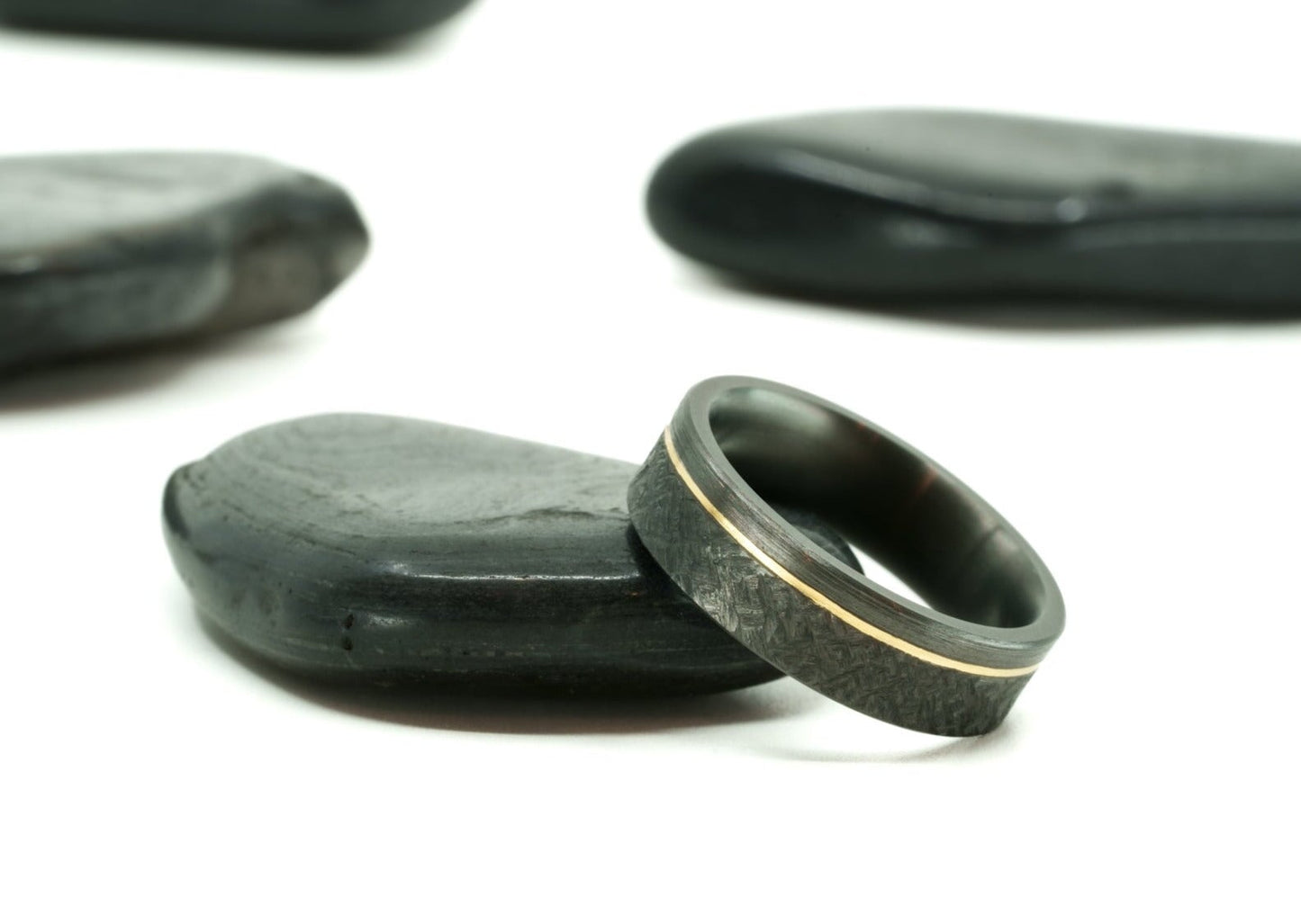 Close-up of the textured etch and brushed finish on the 'Rae' black zirconium ring