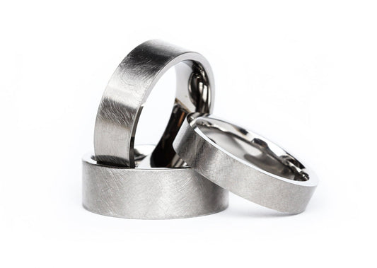 "Brüns" titanium rings with distressed finish and polished interior